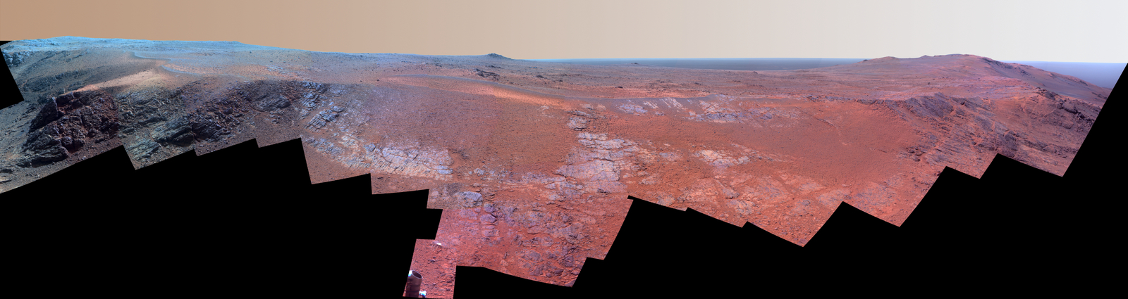 A grooved ridge called "Rocheport" on the rim of Mars' Endeavour Crater spans this scene from the Pancam on NASA's Mars rover Opportunity. This version of the scene is presented in enhanced color to make differences in surface materials more easily visible.
