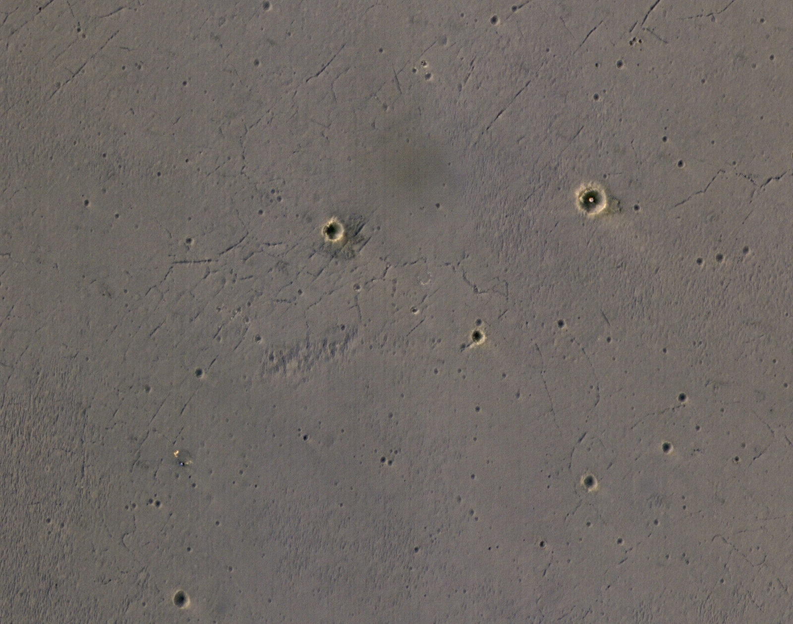 The bright landing platform left behind by NASA's Mars Exploration Rover Opportunity in 2004 is visible inside Eagle Crater, at upper right in this April 8, 2017, observation by NASA's Mars Reconnaissance Orbiter.