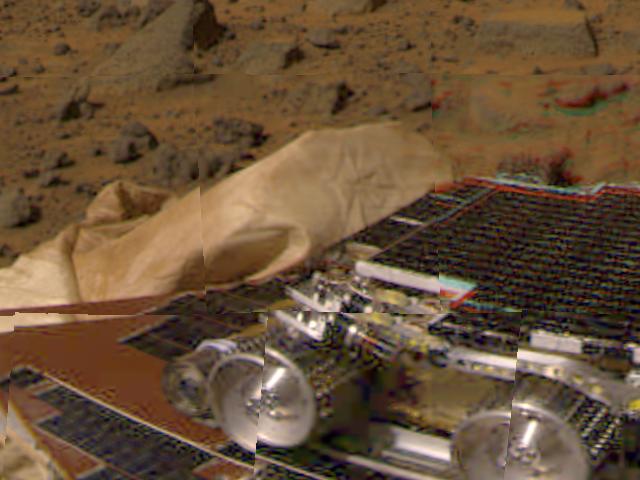 Large boulders are visible in this enlargement of pictures taken by NASA's Mars Pathfinder lander camera on July 4, 1997. The landing site is in the dry flood channel named Ares Valles.