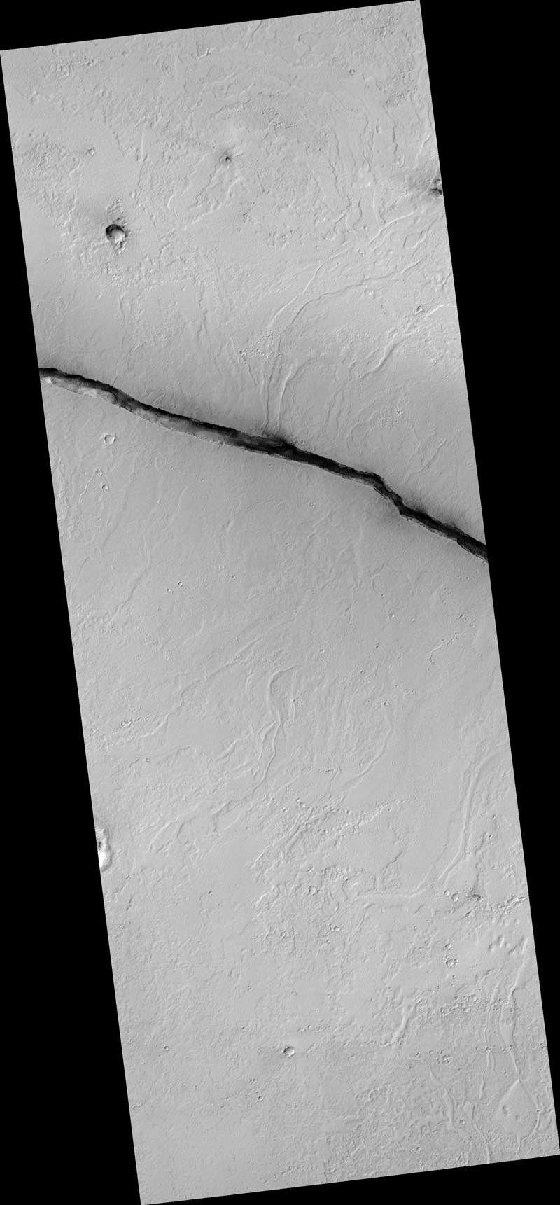 The linearity of the volcanic vent shown in this HiRISE image, in conjunction with evidence of lava flow from the vent, suggests control by combined volcano-tectonic processes. The details of this vent gained by HiRISE should provide insight into those volcano-tectonic processes along Cerberus Fossae fissures in two ways.