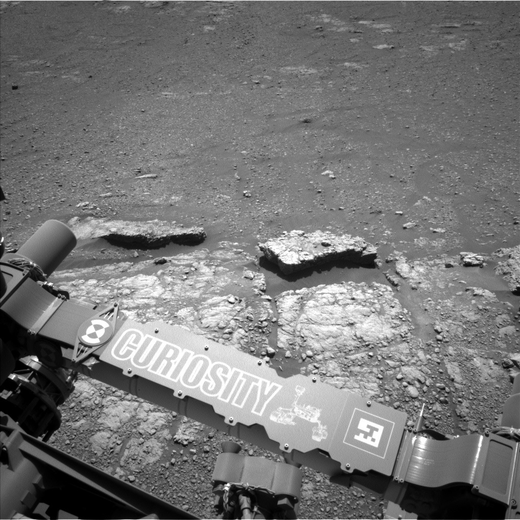 A view of possible pebble-forming rocks in front of the rover. A rock designated as "Quarff" is in the middle-left of the image.