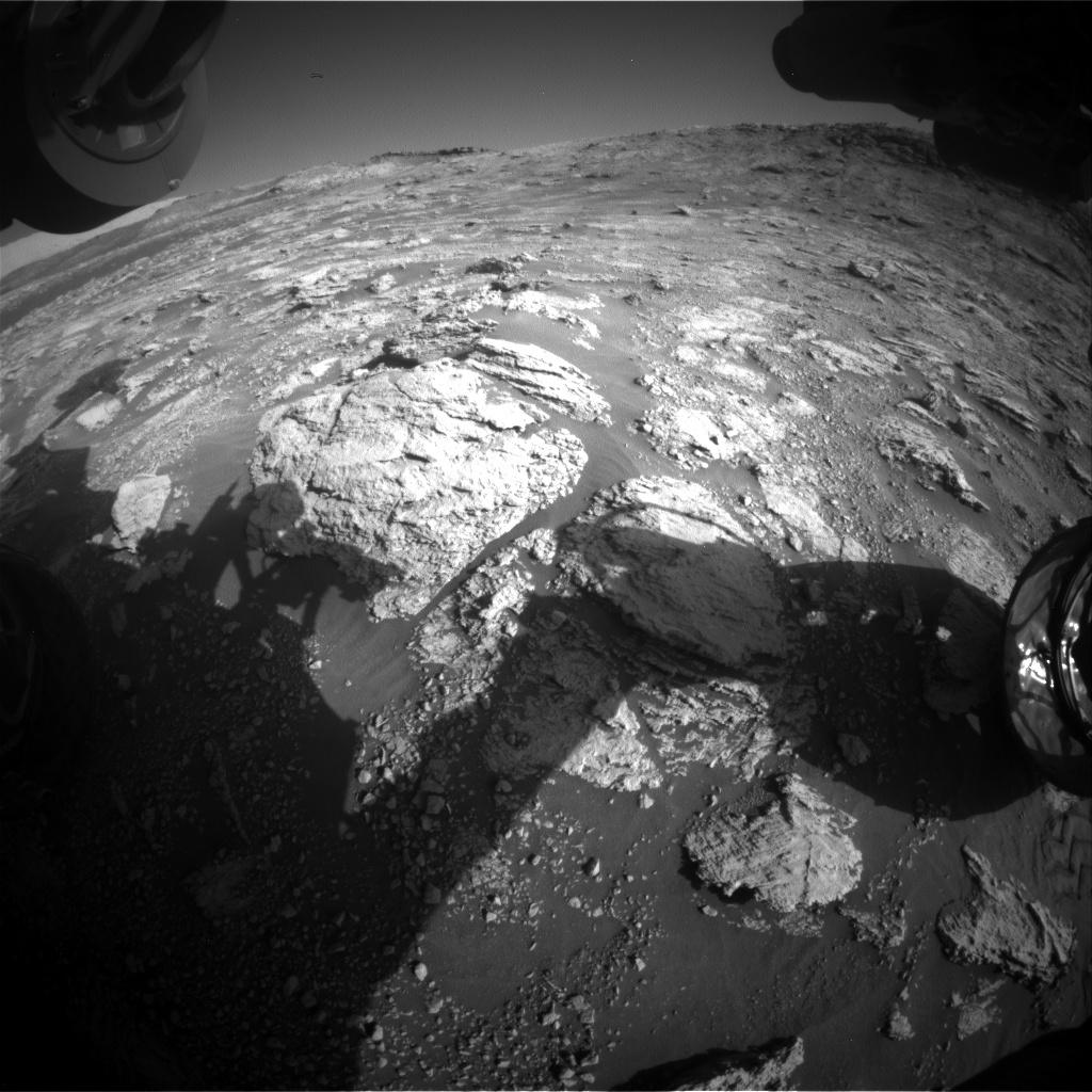 The shadow of Curiosity’s arm in the new workspace.