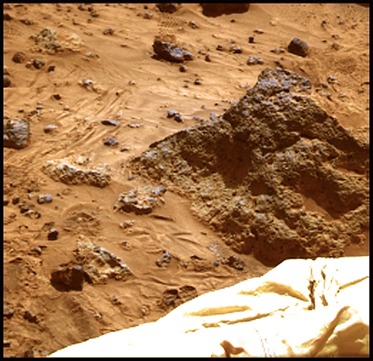 The 'Mini Matterhorn' is a 3/4 meter rock immediately east-southeast of NASA's Mars Pathfinder lander. This image was produced by combining the 'Super pan' frames from the IMP camera. Sol 1 began on July 4, 1997.