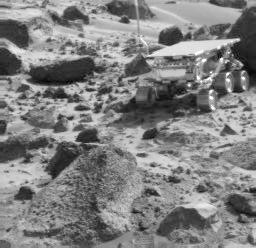 NASA's Imager for Mars Pathfinder (IMP) image taken near the end of daytime operations on Sol 50 shows the Sojourner rover between the rocks 'Wedge' (foreground) and 'Shark' (behind rover). Sol 1 began on July 4, 1997.