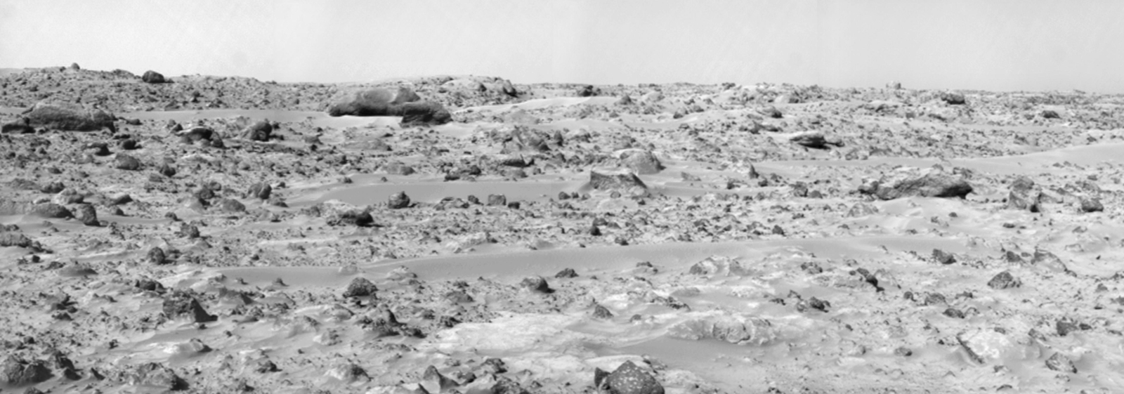This view from NASA's Mars Pathfinder was produced in 1997 by combining 8 individual 'Superpan' scenes from the left and right eyes of the IMP camera. The large, elongated rock 'Zaphod' sits left of center in the middle distance.