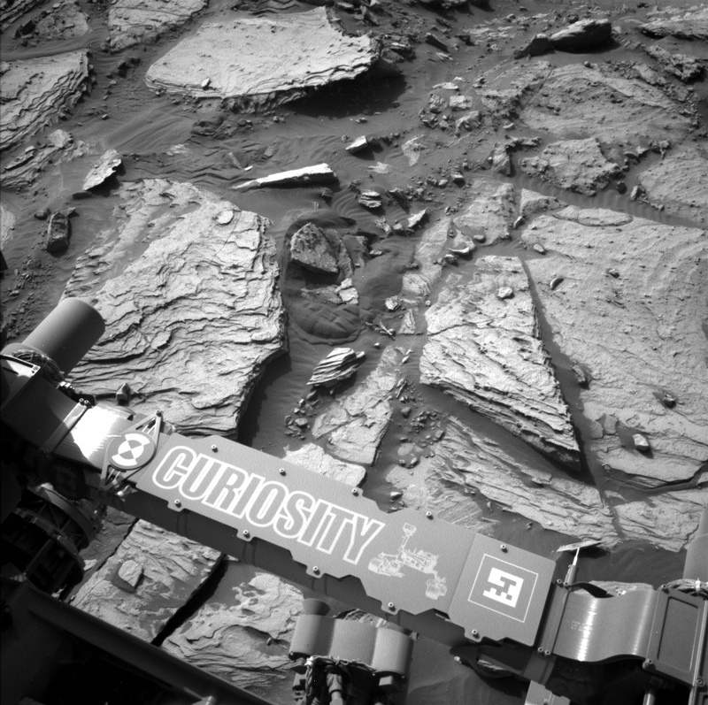 Part of the rover and Mars' surface seen by the left navigation camera onboard Curiosity