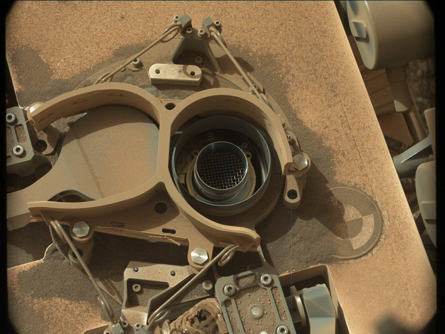 This image is a view of the SAM sample inlet before dropping off the "Glasgow" drill sample taken by Mast Camera (Mastcam) onboard NASA's Mars rover Curiosity on Sol 2765.