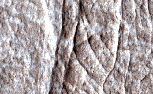 Dense clusters of crack-like structures called deformation bands form the linear ridges prominent in this image from the High Resolution Imaging Science Experiment (HiRISE) camera on NASA's Mars Reconnaissance Orbiter.