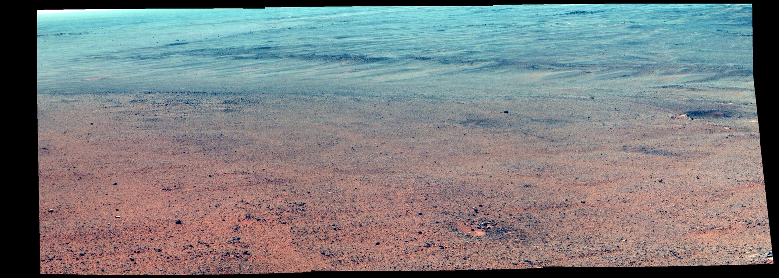 The Pancam on NASA's Mars Exploration Rover Opportunity took the component images of this enhanced-color scene during the mission's "walkabout" survey of an area just above the top of "Perseverance Valley," in preparation for driving down the valley.
