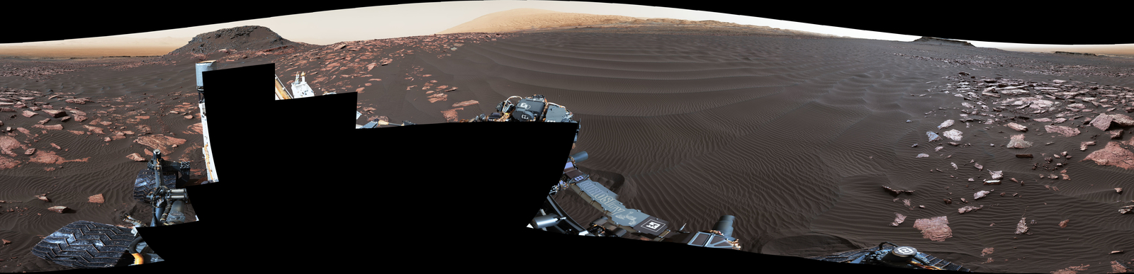 A rippled linear dune of dark Martian sand, "Nathan Bridges Dune," dominates this full-circle panorama from the Mastcam of NASA's Curiosity Mars rover. This dune was one research stop of the mission's campaign to investigate active Martian dunes. Nathan Bridges (1966-2017) helped lead that campaign