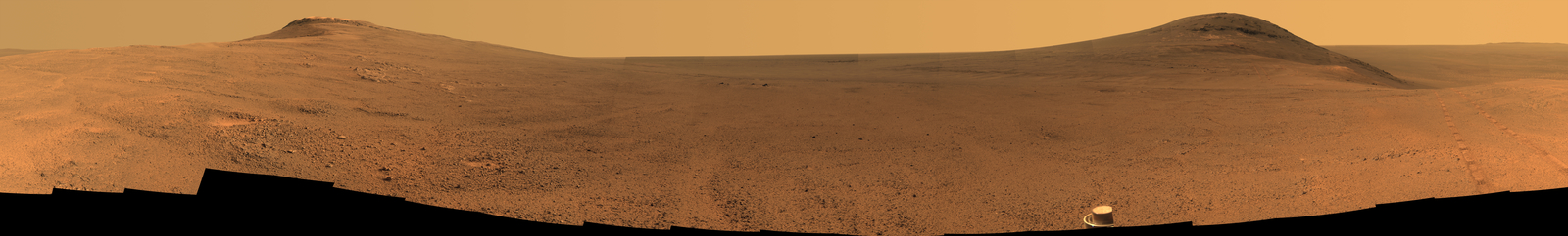 This June 2017 view  from the Pancam on NASA's Opportunity Mars rover shows the area just above  "Perseverance Valley" on a large crater's rim. A broad notch in the  crest of the rim, at right, might have been a spillway for a fluid that carved  the valley, out of sight on the other side of the rim.