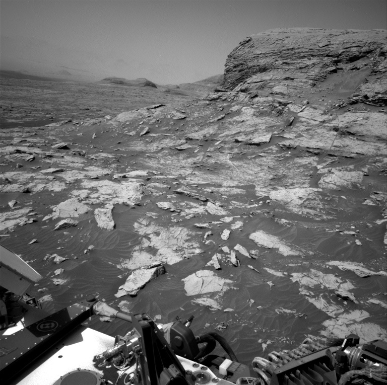 Part of Curiosity rover are visible in this Mars view