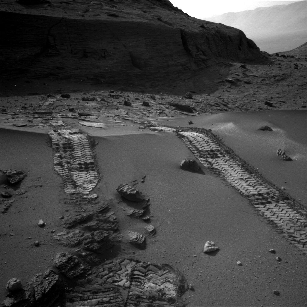 Image of Curiosity’s tire tracks over a sand ripple.