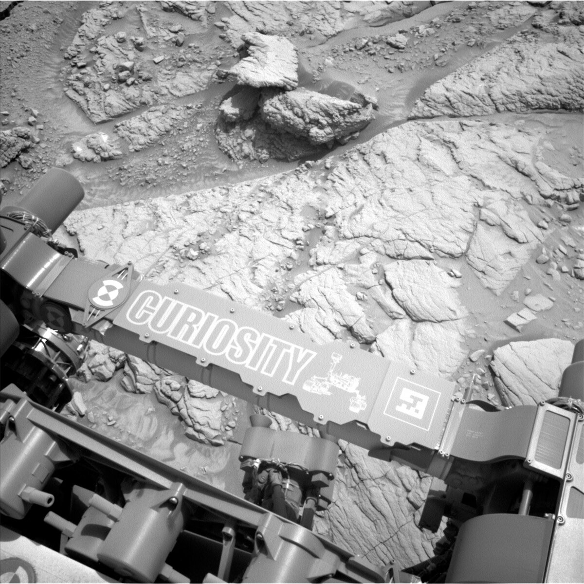 This image shows Curiosity's nameplate above the Mars surface and was taken by Left Navigation Camera onboard Curiosity on Sol 3655.