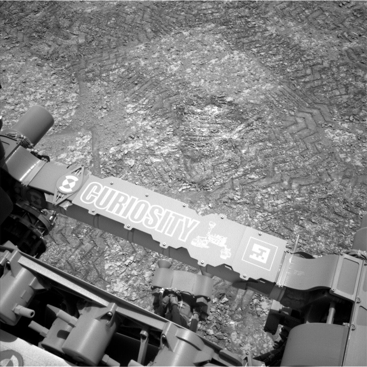 This image shows Curiosity's nameplate above the rocky Martian terrain and was taken by Left Navigation Camera on Curiosity on Sol 3690.