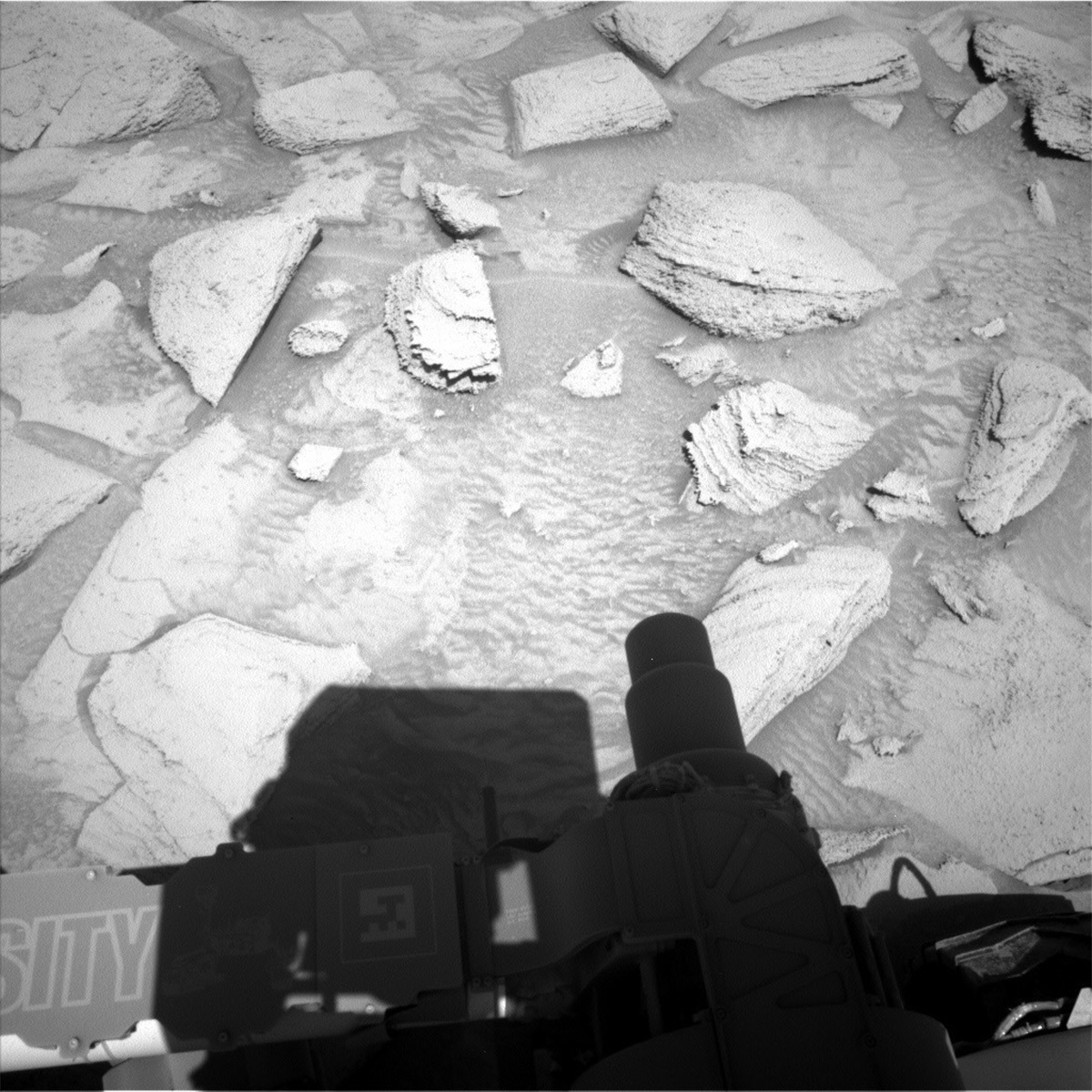 This image of part of the Curiosity Rover and its shadow above the Mars surface was taken by Left Navigation Camera onboard NASA's Mars rover Curiosity on Sol 3815.