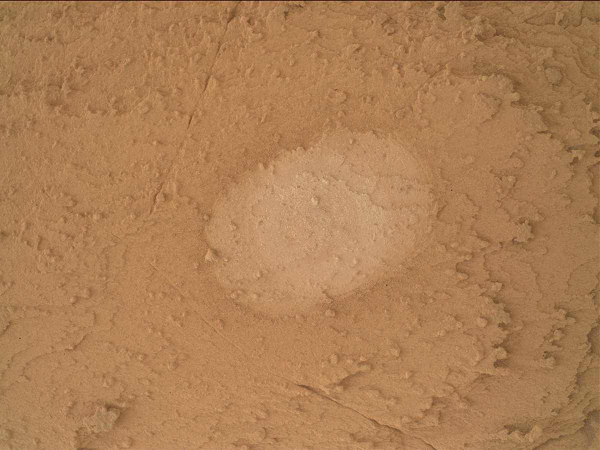 This is a MAHLI image of the brushed, flat and oval-shaped Ubajara potential drill target taken on sol 3819.