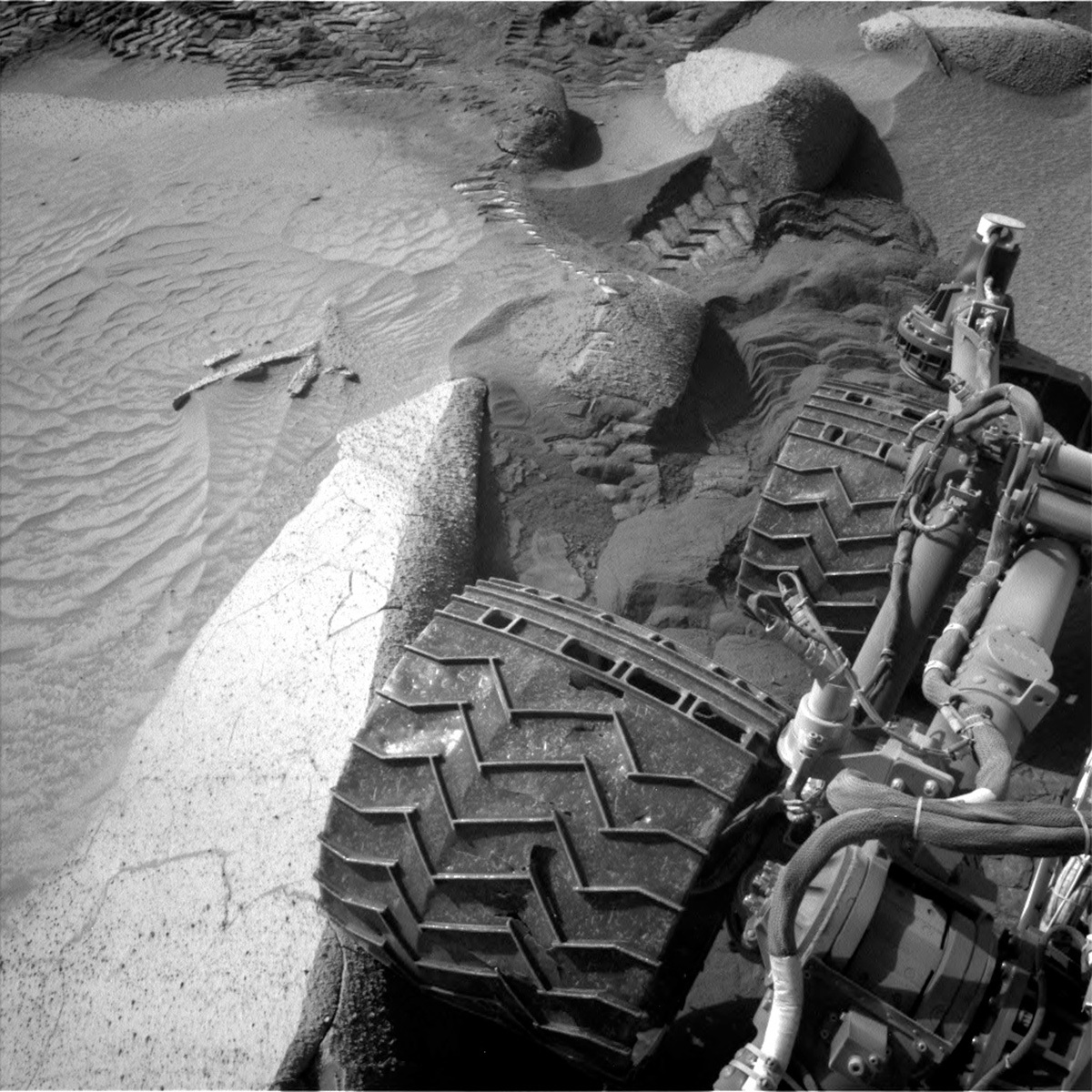 This image of the Curiosity rover's wheels on the Mars surface was taken by Left Navigation Camera onboard NASA's Mars rover Curiosity on Sol 3846.