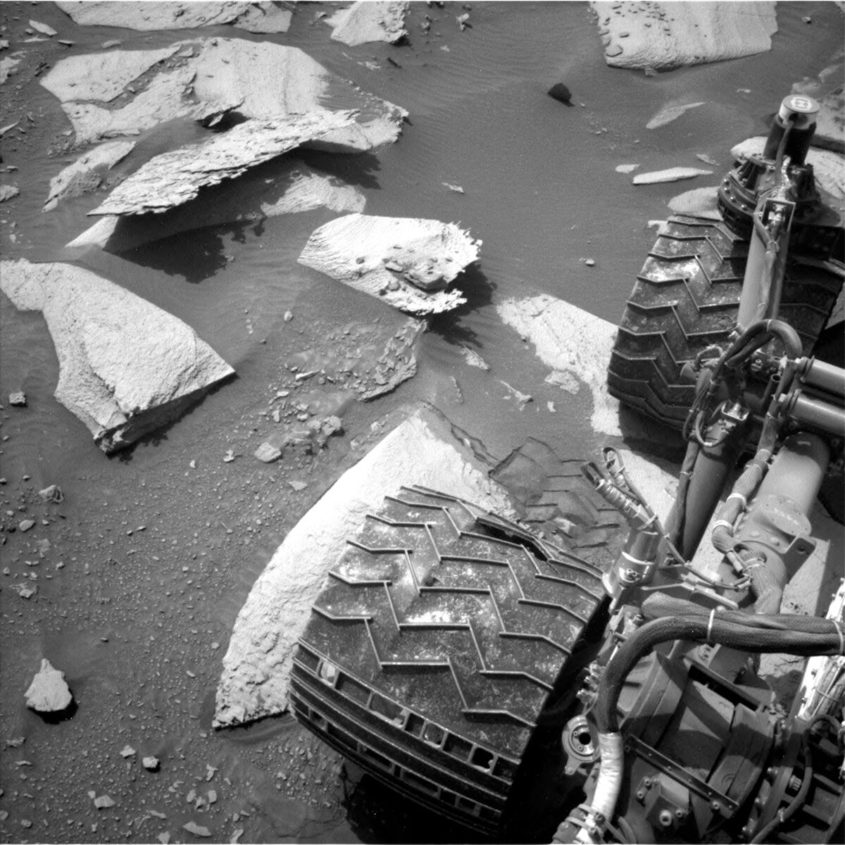 This image of the rover wheels above the Mars surface was taken by Left Navigation Camera onboard NASA's Mars rover Curiosity on Sol 4074.