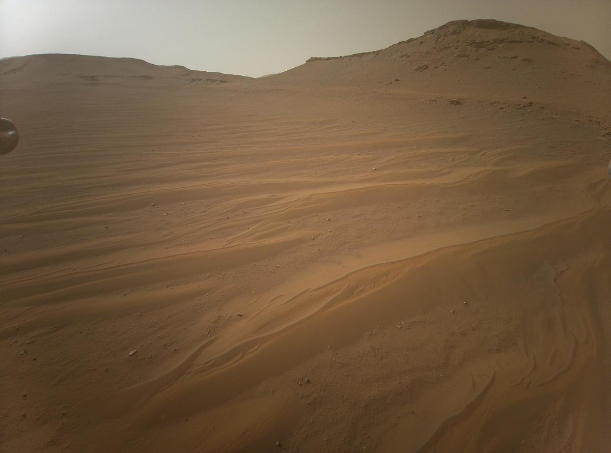 NASA's Ingenuity Mars Helicopter acquired this image using its high-resolution color camera. This camera is mounted in the helicopter's fuselage and pointed approximately 22 degrees below the horizon.