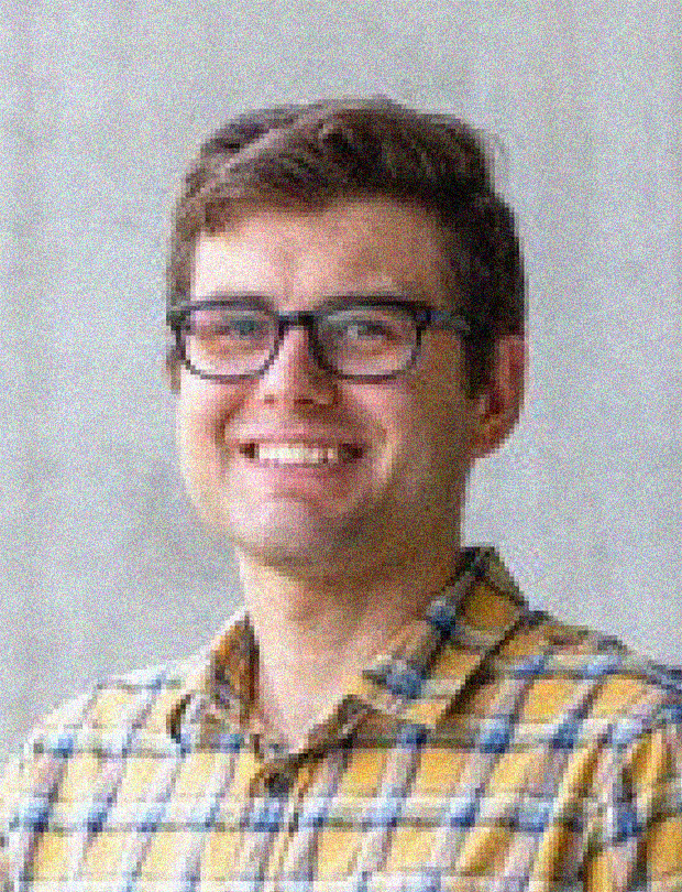 Brandon Chalifoux headshot, male, light brown hair, glasses, yellow plaid button-down shirt, smile.