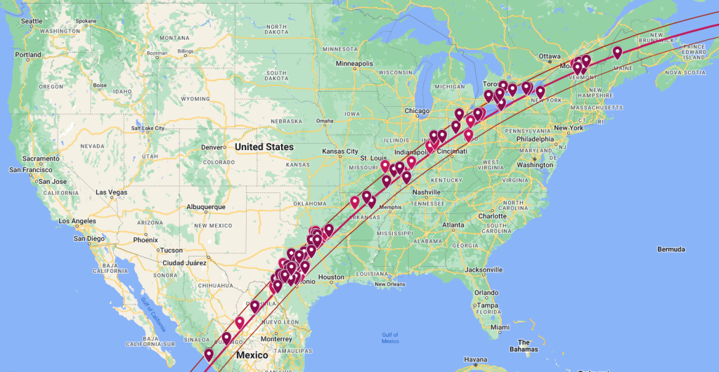 A map of North America, primarily showing the United States. There is a line that crosses from Mexico, into Texas, across the U.S. until Maine, and exits into the ocean off the coast of Canada. There are many red markers along that path indicating the locations of Eclipse Megamovie participants.