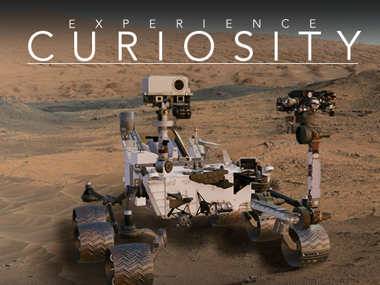 Experience Curiosity app banner displaying the Mars Science Laboratory rover, Curiosity on Mars. The rover is facing the point of view of the user. It has 6 metal wheels and a white body. On top of the body. The Mars background shows a sandy and rocky landscape with brown and orange colors.