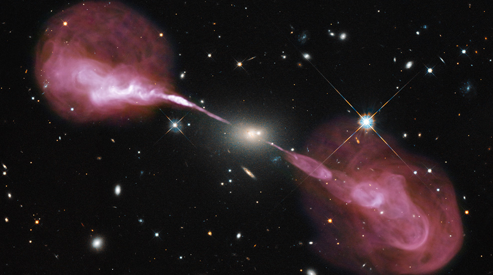 Black space with multiple galaxies visible, large white glowing supermassive black hole in the center. two bright stars on each side, and two pink jets of gas streaming out of either side of the center star.