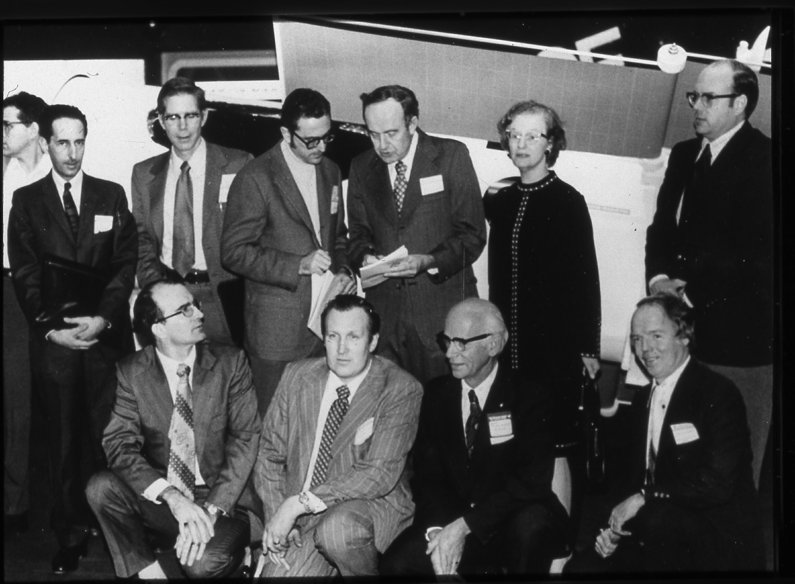 Black and white image. Two rows of dignitaries attending a meeting at NASA.