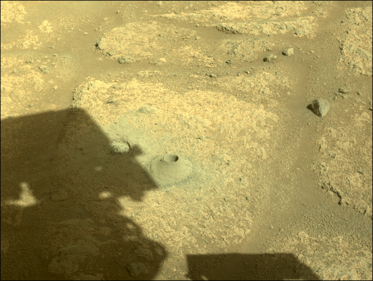 Image taken was taken by the Mars Perseverance rover after collecting the rock sample 1 at Roubion.