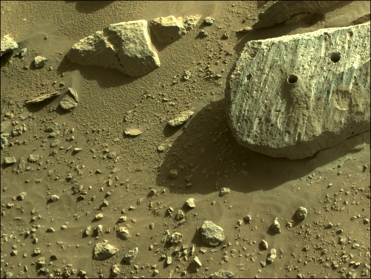 Image taken was taken by the Mars Perseverance rover after collecting the rock sample 3 at Montagnac.