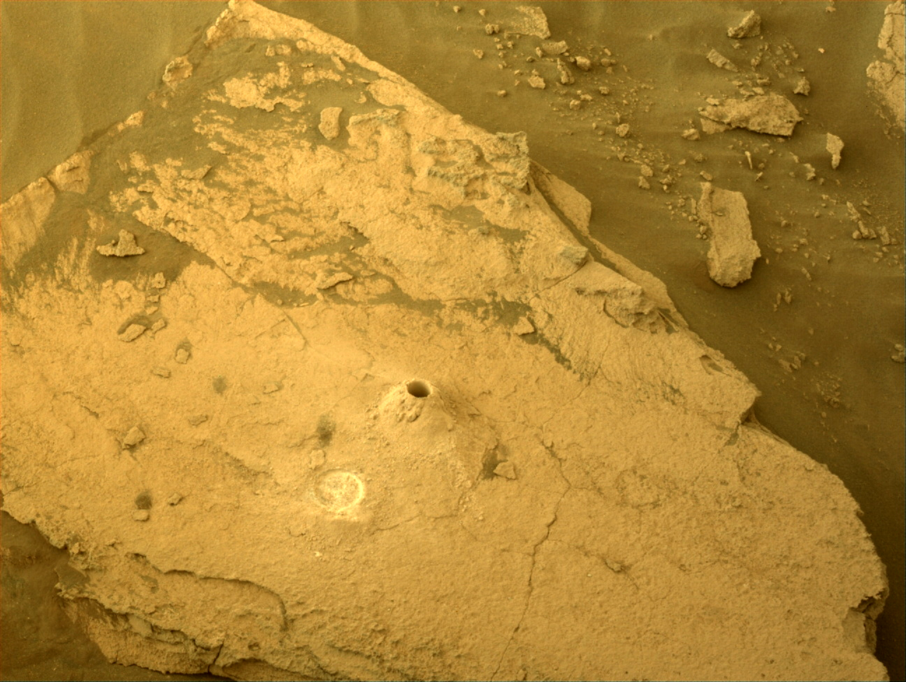 Image taken was taken by the Mars Perseverance rover after collecting the rock sample 10 at Swift Run.