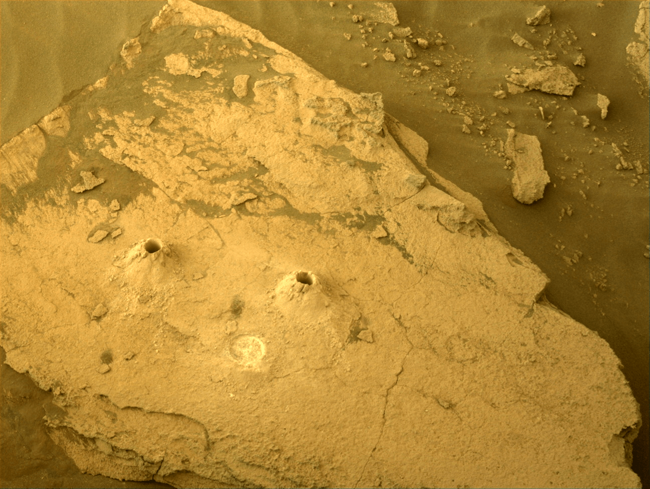Image taken was taken by the Mars Perseverance rover after collecting the rock sample 11 at Skyland. Sample 10 and 11 drill hole with an abrasion patch.