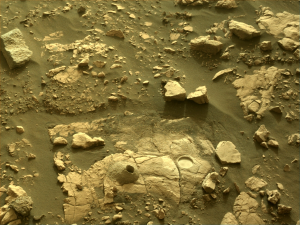Image taken was taken by the Mars Perseverance rover after collecting the rock sample 12 at Hazeltop. There is a drill hole and a nearby abrasion patch displayed in this photo.