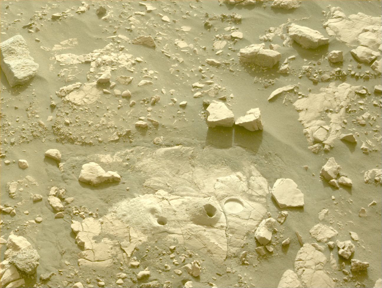 Image taken was taken by the Mars Perseverance rover after collecting the rock sample 13 at Bearwallow. There are two drill holes and an abrasion patch in this photo.