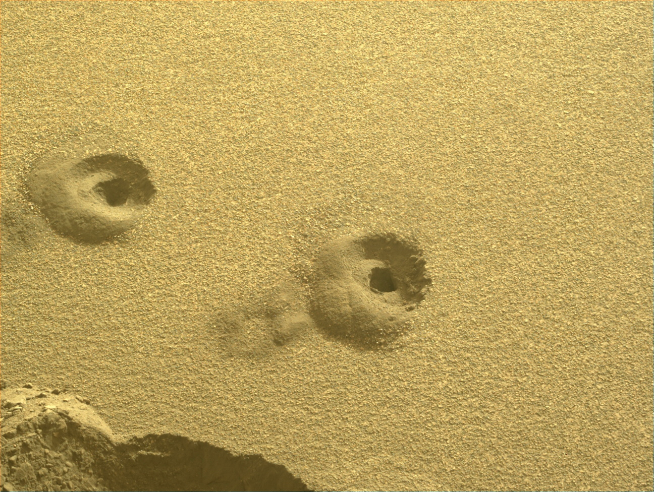 Image taken was taken by the Mars Perseverance rover after collecting the rock sample 18 at Crosswind Lake. This image shows both samples 17 and 18 drill holes nearby.