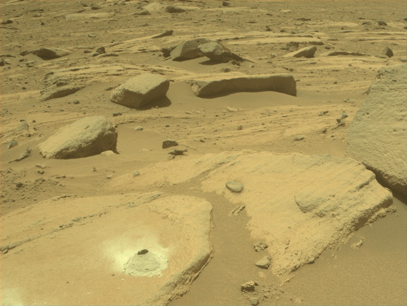 Image taken was taken by the Mars Perseverance rover after collecting the rock sample 19 at Melyn.