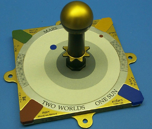 The calibration tool is a sundial marked with with the words, two worlds, one sun.