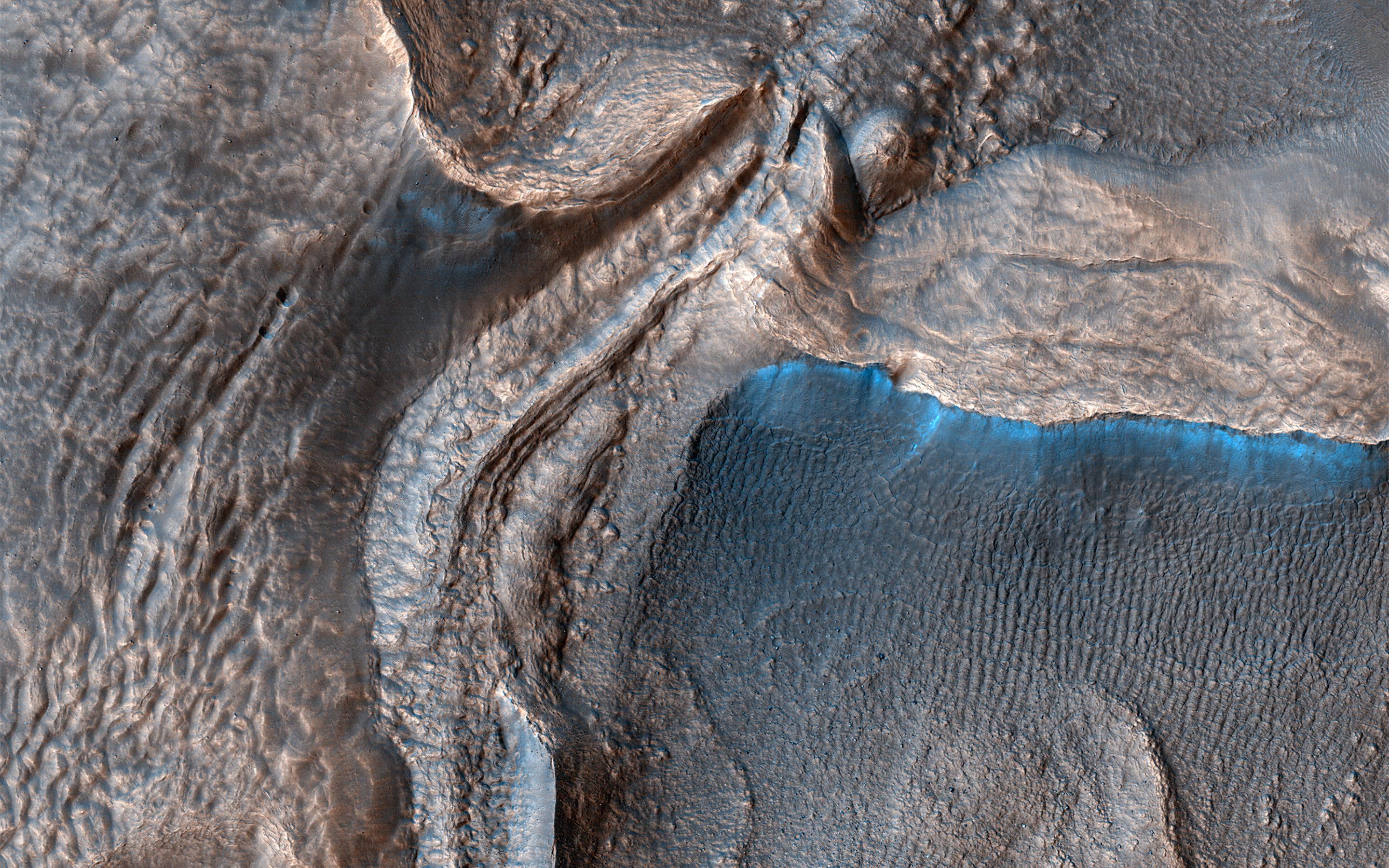 Harmakhis Vallis, an approximately 800-kilometer long outflow channel located in eastern Hellas on Mars. This is a large rock formation.