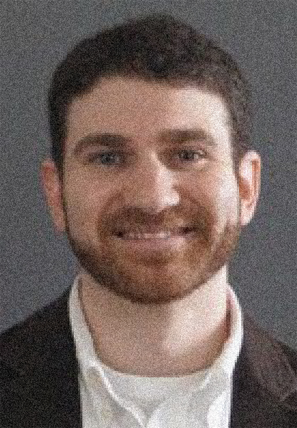 Jonathan Pober headshot, male, reddish brown hair, beard, smile.