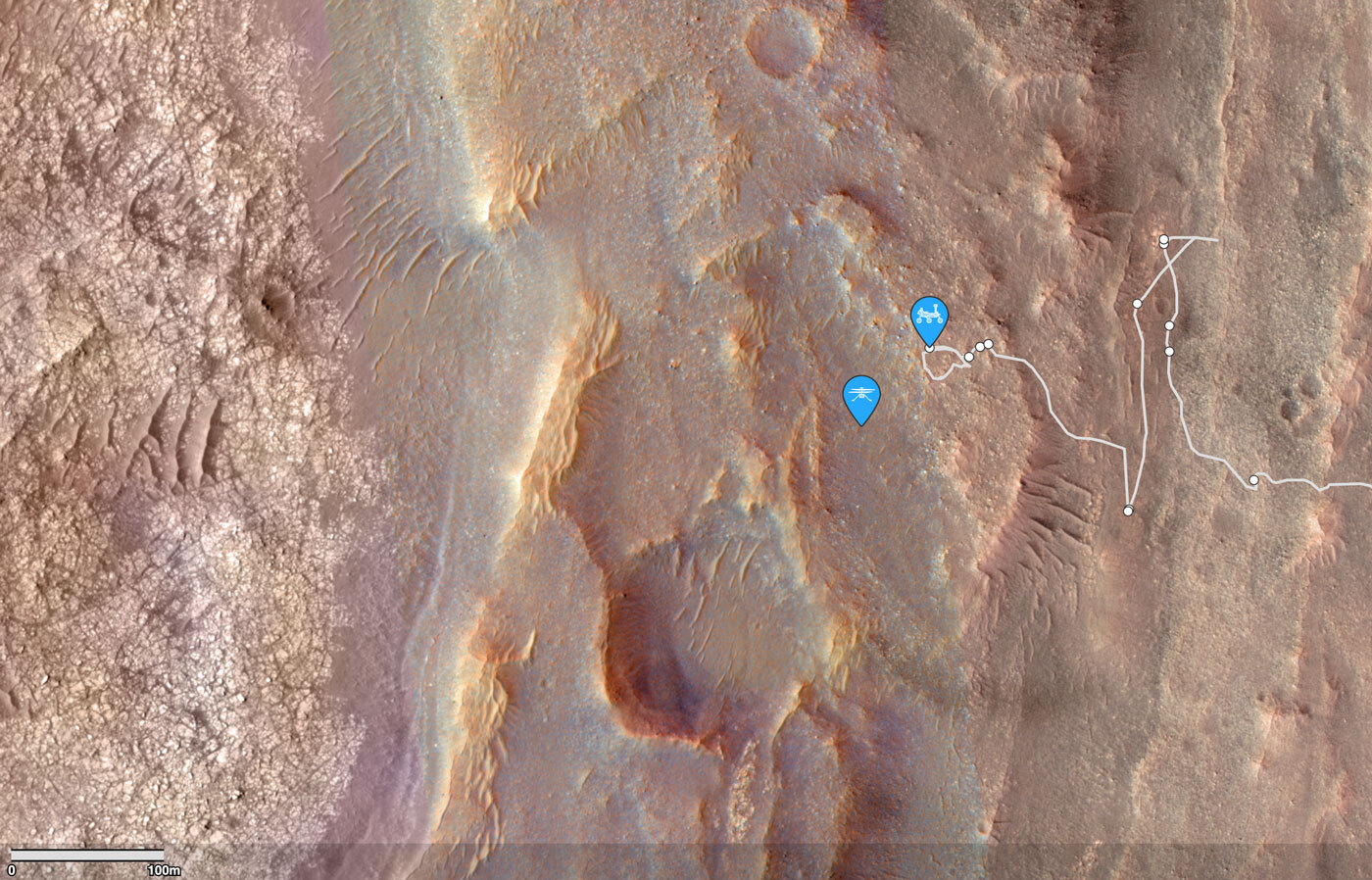 This is an orbital view showing the approximate location of the Perseverance rover and the Ingenuity helicopter. The fractured, light-toned material on the left-side of the panel, ~400 m ahead of the rover, corresponds to the Margin Carbonate Unit.