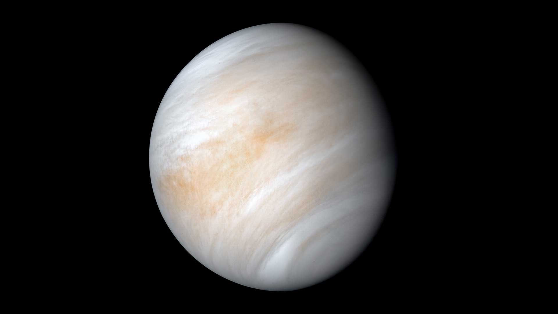 A serene-looking Venus with creamy white, and tan clouds.