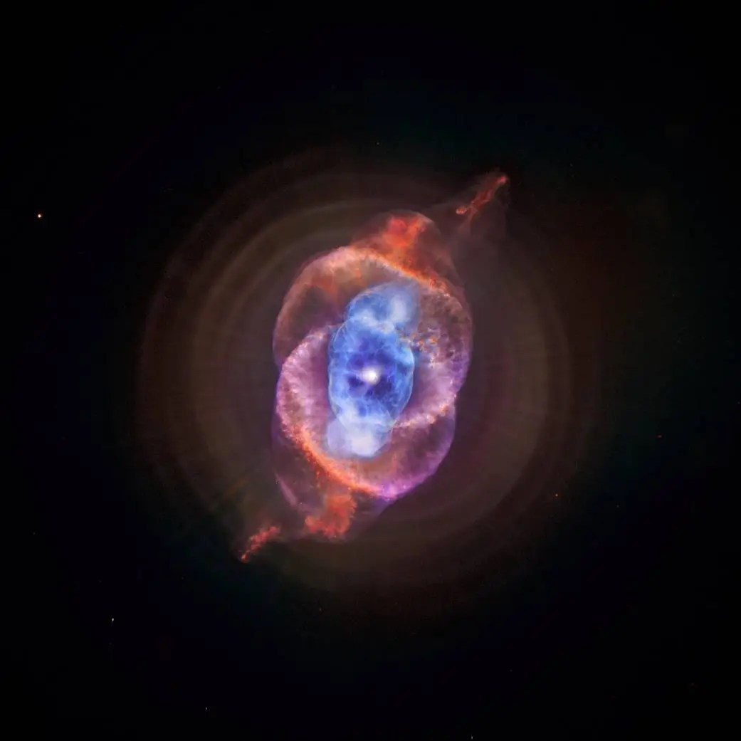 This composite of data from NASA's Chandra X-ray Observatory and Hubble Space Telescope gives astronomers a new look for NGC 6543, better known as the Cat's Eye nebula. This planetary nebula represents a phase of stellar evolution that our sun may well experience several billion years from now.