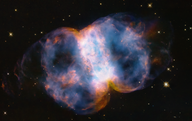 Hubble Marks its 34th Anniversary with Images of the Little Dumbbell Nebula