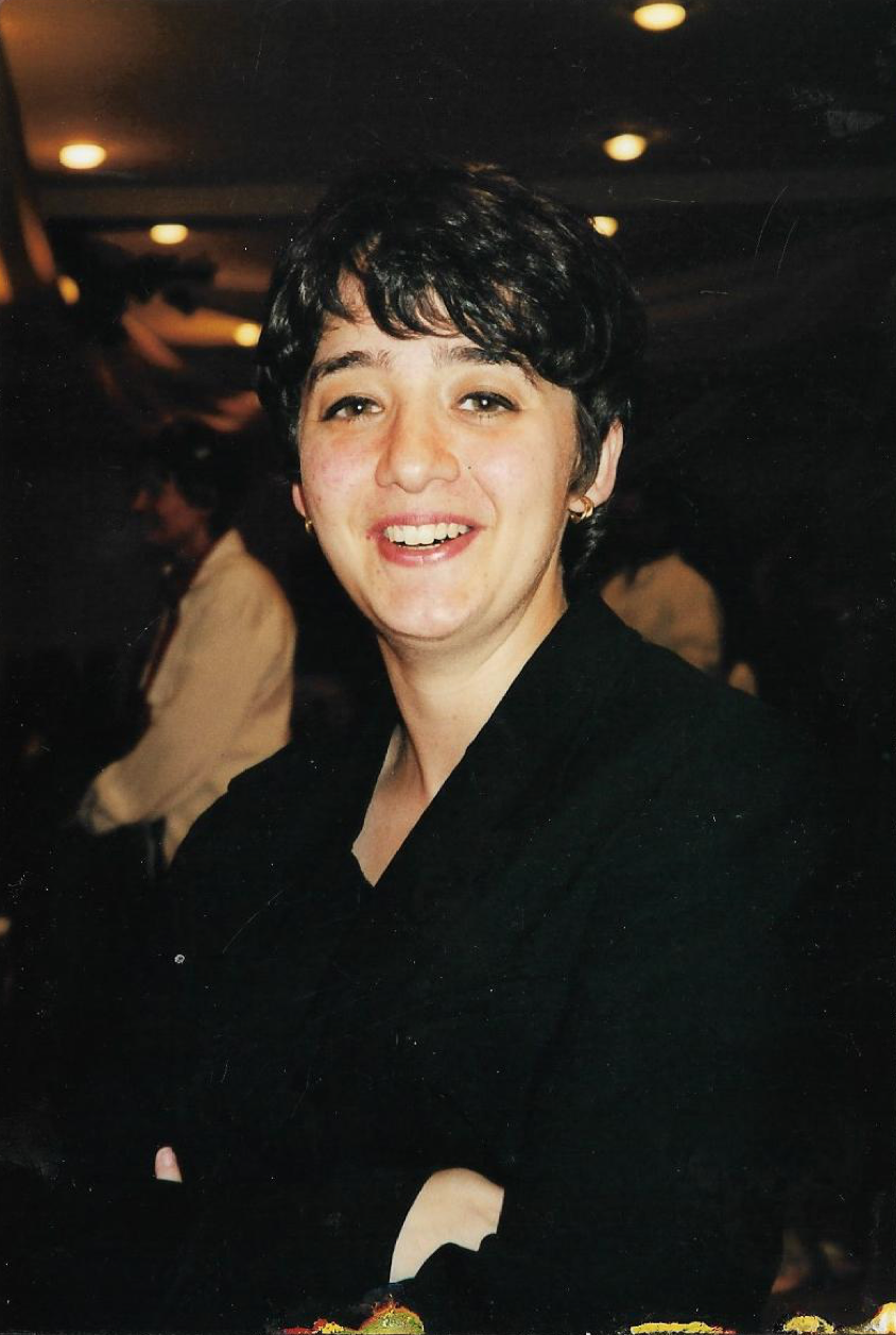 A smiling woman facing the camera