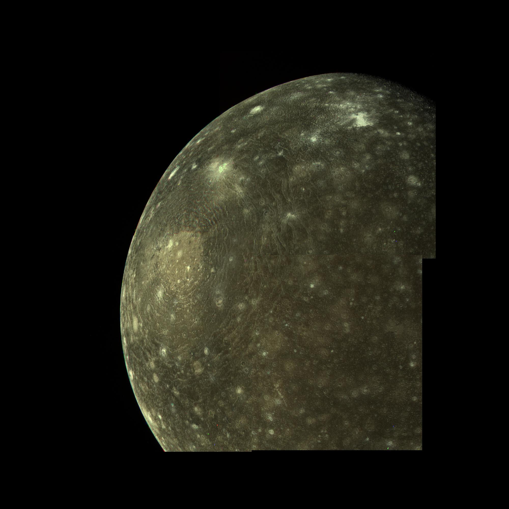 A close-up of most of Callisto focused on a giant impact structure with concentric rings radiation for miles from the center.