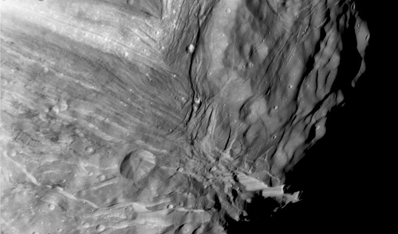 A close-up of Miranda reveals tall mesas and deep, sinuous valleys.