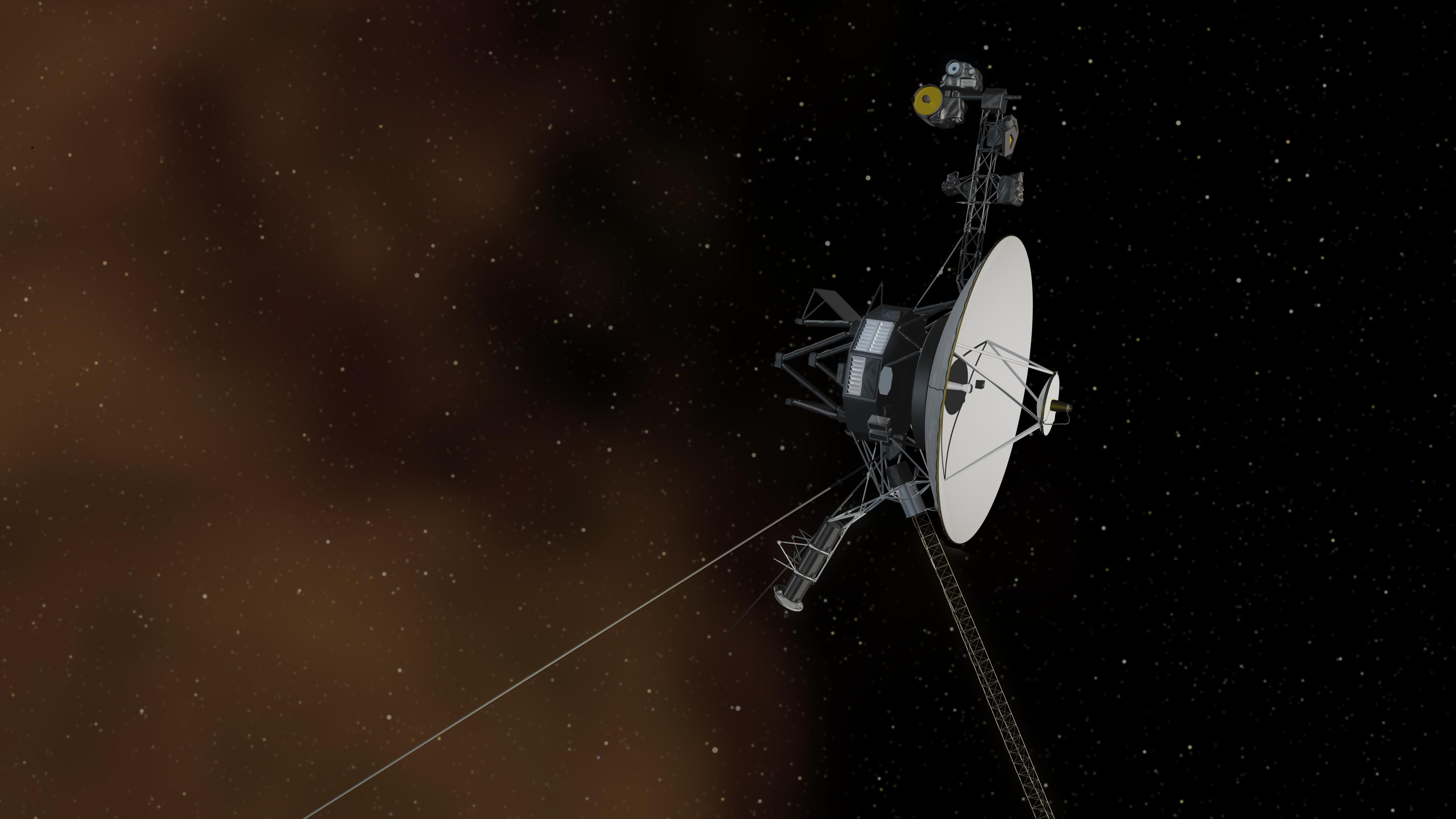 A Voyager spacecraft is shown in deep space among distant stars and gases.