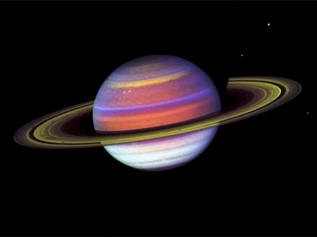 Saturn's cloud bands are vivid in this color-enhanced view of the gas giant.