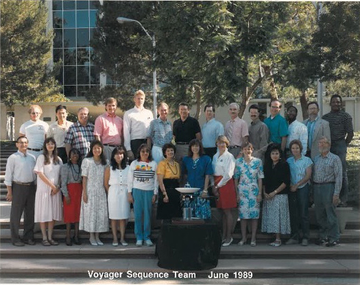 A group of people comprising the Voyager Sequencing Team, posed together on the JPL stairs